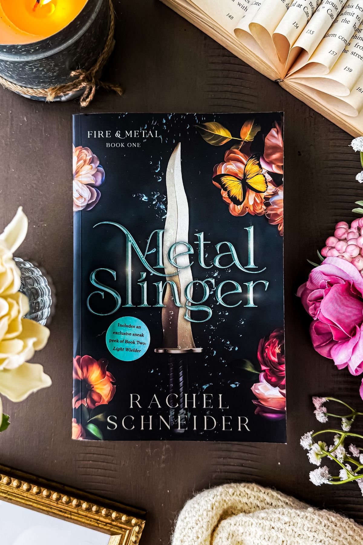 metal slinger book on iPad with flowers and candles.