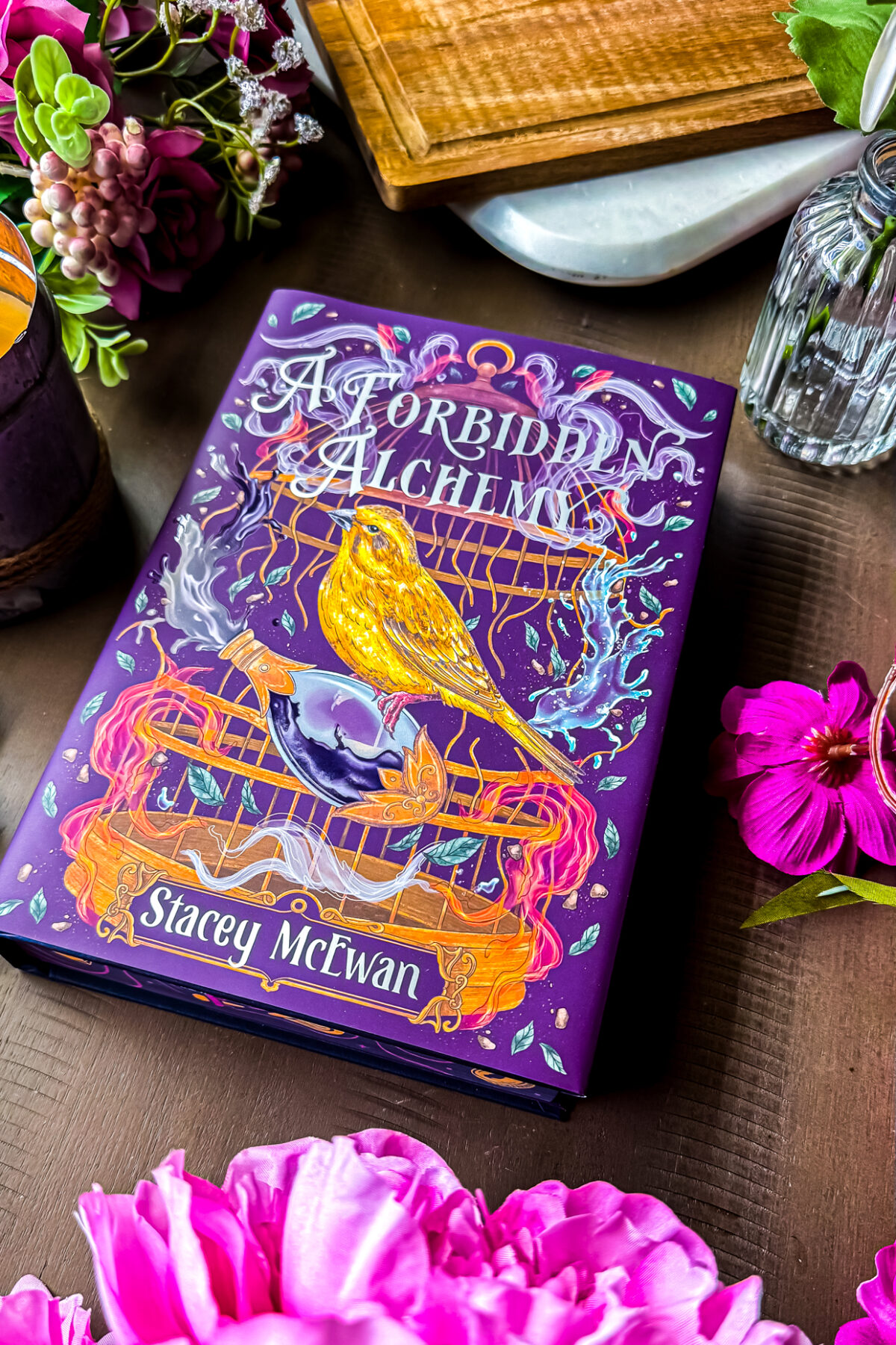 flatly of book a forbidden alchemy with flowers.