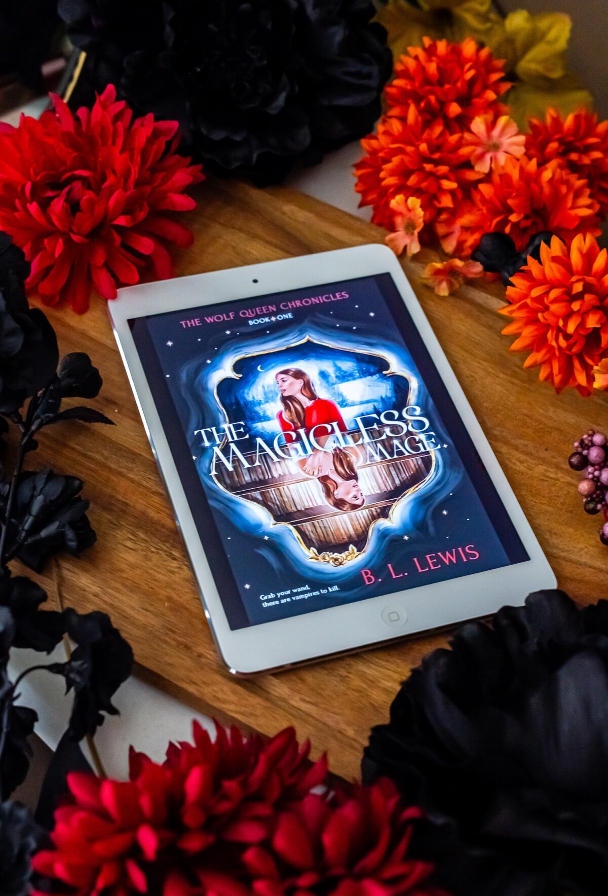 iPad with the Magicless Mage surrounded by flowers.