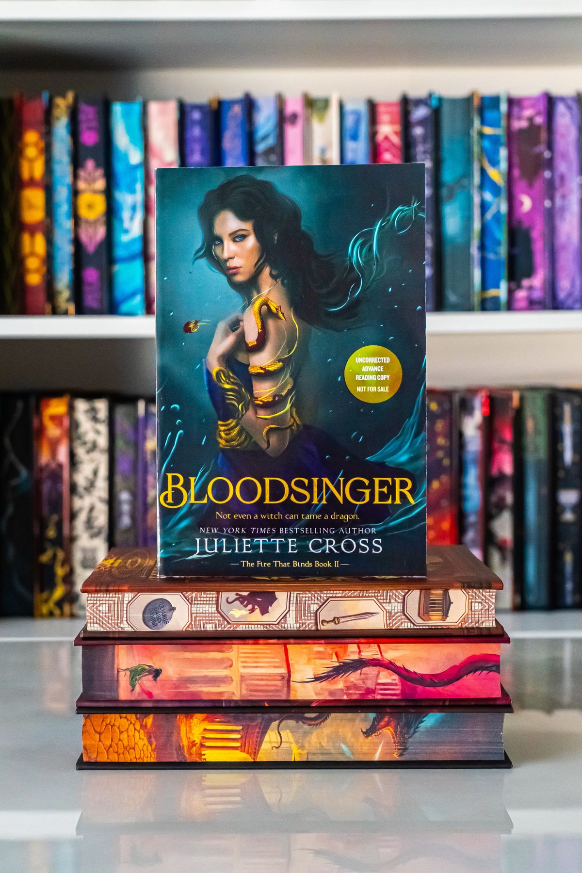 Bloodsinger book on top of 3 Firebird books.