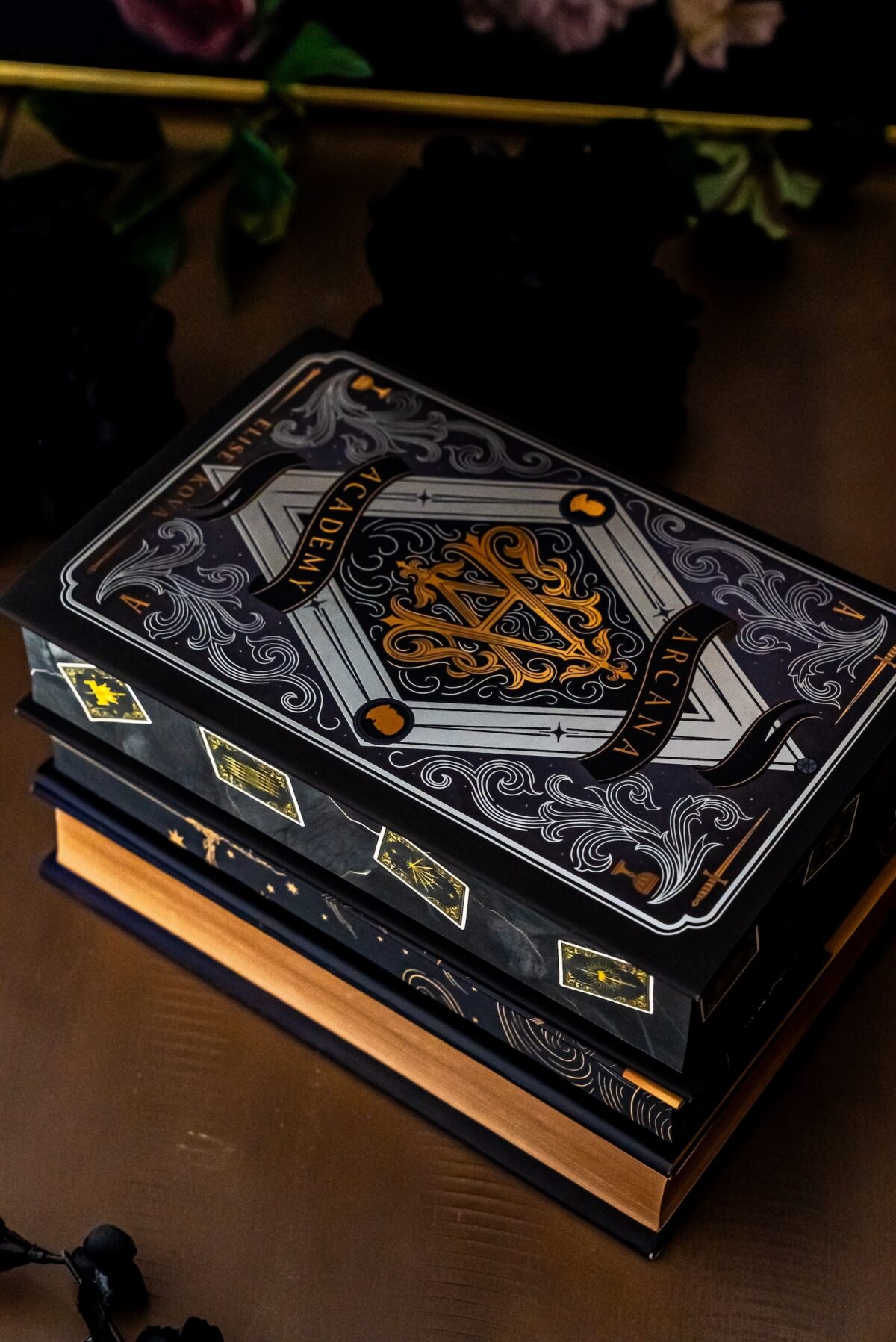 arcana academy book stack.